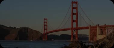 Golden Gate Bridge over San Francisco Bay with orange tones