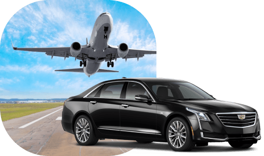Luxury black sedan positioned on the runway with a low-angle shot of a plane flying overhead, ready for airport pickup.