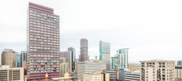 Denver, Colorado, skyline showing skyscrapers and mountains
